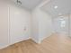 Bright entryway with white walls, light wood floors, and a view into other rooms at 705 Coastal Lagoon St, Henderson, NV 89002