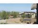 Scenic backyard view showcasing a covered patio and distant city views at 754 Agate Hills St, Las Vegas, NV 89138