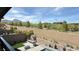 Private backyard with lush landscaping, a modern built-in barbeque, and mountain views at 754 Agate Hills St, Las Vegas, NV 89138