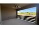 Covered outdoor balcony with views of a desert landscape and neighborhood at 754 Agate Hills St, Las Vegas, NV 89138