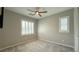 Bedroom with neutral walls, plush carpet, plantation shutters and a ceiling fan for comfort at 754 Agate Hills St, Las Vegas, NV 89138