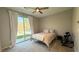 Neutral toned bedroom featuring a large sliding glass door leading to backyard at 754 Agate Hills St, Las Vegas, NV 89138