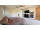 Open bedroom space with a closet, dresser, full-length mirror, and TV at 754 Agate Hills St, Las Vegas, NV 89138