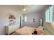 Charming bedroom with a ceiling fan, and shuttered windows for a bright interior at 754 Agate Hills St, Las Vegas, NV 89138