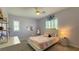 Cozy bedroom with a ceiling fan, and shuttered windows, providing ample natural light at 754 Agate Hills St, Las Vegas, NV 89138