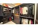 Spacious walk-in closet with custom shelving and rods to organize clothing, shoes, and accessories at 754 Agate Hills St, Las Vegas, NV 89138