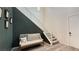 Stylish foyer with high ceilings, seating, and staircase create a modern, inviting entry at 754 Agate Hills St, Las Vegas, NV 89138