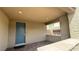 A welcoming front porch with brick flooring, a blue door, and a neutral exterior at 754 Agate Hills St, Las Vegas, NV 89138