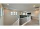 Bright upstairs hallway with natural light, leading to a cozy media room at 754 Agate Hills St, Las Vegas, NV 89138
