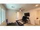 Bright home gym with a treadmill, desk area, weights, and ceiling fan at 754 Agate Hills St, Las Vegas, NV 89138