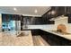 Spacious kitchen boasts granite counters, stainless appliances, dark cabinets, and a large sink at 754 Agate Hills St, Las Vegas, NV 89138