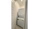 Compact laundry closet featuring a stacked washer and dryer at 754 Agate Hills St, Las Vegas, NV 89138