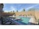 A sparkling modern pool with attached hot tub, built-in grill, and low-maintenance backyard at 754 Agate Hills St, Las Vegas, NV 89138