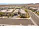 Stunning aerial view of a modern home with a well-manicured lawn and desert landscaping at 826 Bolide St, Las Vegas, NV 89138
