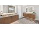 Modern bathroom featuring double vanity, undermount sinks, and an oversized lighted mirror at 826 Bolide St, Las Vegas, NV 89138