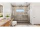 Contemporary bathroom with walk-in shower, and modern vanity with ample lighting at 826 Bolide St, Las Vegas, NV 89138