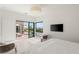 Comfortable bedroom with views of the outdoor patio, lounge, and pool area at 826 Bolide St, Las Vegas, NV 89138