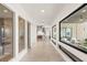 Bright hallway featuring many windows which illuminate the view of the backyard and kitchen at 826 Bolide St, Las Vegas, NV 89138