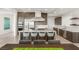 Modern kitchen featuring a large center island with seating, stainless steel appliances, and sleek cabinetry at 826 Bolide St, Las Vegas, NV 89138