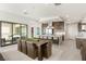 Spacious kitchen and dining area features a large island with seating, stainless steel appliances, and an open layout at 826 Bolide St, Las Vegas, NV 89138