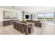 Inviting living room featuring a dining area, modern decor, and large windows with scenic views at 826 Bolide St, Las Vegas, NV 89138