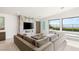 Bright living room with marble fireplace, large sectional, and stunning outdoor views at 826 Bolide St, Las Vegas, NV 89138