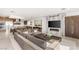 An open-concept living room and kitchen with a fireplace and modern furnishings at 826 Bolide St, Las Vegas, NV 89138