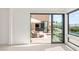 Sliding glass door leads to outdoor seating area and backyard pool at 826 Bolide St, Las Vegas, NV 89138