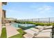 Backyard oasis featuring a pool, lounge chairs, landscaping, and city views at 826 Bolide St, Las Vegas, NV 89138