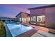 Sparkling pool reflecting the sky, complemented by stylish outdoor lounge furniture, inviting relaxation at 826 Bolide St, Las Vegas, NV 89138