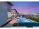 Inviting pool and spa area with stylish outdoor seating and lush landscaping for relaxation at 826 Bolide St, Las Vegas, NV 89138