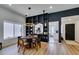 Dining room with hardwood flooring, modern chandelier, and adjacent open shelving at 8640 Trafalgar Dr, Las Vegas, NV 89117