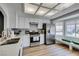 Bright kitchen featuring stainless steel appliances, white cabinets, a breakfast nook with bay window, and wood floors at 8640 Trafalgar Dr, Las Vegas, NV 89117