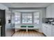 Bright kitchen nook with stainless steel appliances, white cabinetry, and a breakfast nook at 8640 Trafalgar Dr, Las Vegas, NV 89117