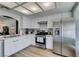 Bright kitchen featuring stainless steel appliances, white cabinets, quartz countertops, and a stainless steel range at 8640 Trafalgar Dr, Las Vegas, NV 89117
