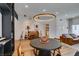 Open-concept living space with modern decor, a dining area, and stylish hardwood floors at 8640 Trafalgar Dr, Las Vegas, NV 89117