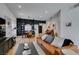 Open-concept living room featuring a modern design with hardwood floors and a stylish leather sofa at 8640 Trafalgar Dr, Las Vegas, NV 89117