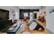 Open-concept living room with hardwood floors, built-in shelving, and comfortable seating at 8640 Trafalgar Dr, Las Vegas, NV 89117
