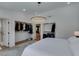 Bright main bedroom with white walls, a large rug, walk-in closet and an ensuite bathroom at 8640 Trafalgar Dr, Las Vegas, NV 89117
