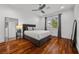 Traditional bedroom features hardwood floors, a ceiling fan, a large window and calming color scheme at 9 Clear Crossing Trl, Henderson, NV 89052