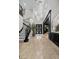 Stunning foyer with high ceilings, decorative lighting, a grand staircase, and an elegant entryway, showcasing the home's luxury at 9 Clear Crossing Trl, Henderson, NV 89052