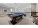 Lofted game room featuring pool table, railing overlooking floor below, and wall mounted mirror at 9 Clear Crossing Trl, Henderson, NV 89052
