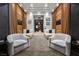 Luxurious home theater with plush seating, custom curtains, and a cozy atmosphere for movie nights and entertainment at 9 Clear Crossing Trl, Henderson, NV 89052