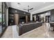 Stylish living room with built-in shelving, sleek furniture, modern fireplace, and seamless flow to the outdoor space at 9 Clear Crossing Trl, Henderson, NV 89052