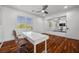 Bright office with white desk, large window, hardwood floors, and a modern adjustable office chair at 9 Clear Crossing Trl, Henderson, NV 89052
