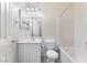 Well-lit bathroom features a tub with shower, toilet, and vanity with storage at 9303 Gilcrease Ave # 1013, Las Vegas, NV 89149