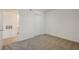 Bedroom with neutral carpet and white closet door at 950 Seven Hills Dr # 1921, Henderson, NV 89052