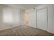 Bedroom with neutral carpet and white closet door at 950 Seven Hills Dr # 1921, Henderson, NV 89052