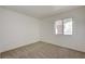 Bright bedroom with neutral carpet, window with blinds, and electrical outlets at 950 Seven Hills Dr # 1921, Henderson, NV 89052