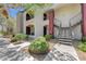 Attractive condo exterior showcasing lush landscaping, stairs to the second level, and stylish architectural details at 950 Seven Hills Dr # 1921, Henderson, NV 89052